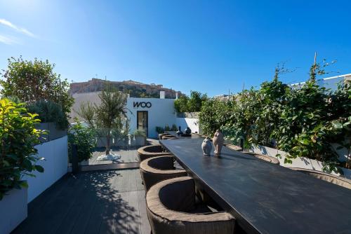 a rendering of a garden with trees and plants at Athens Woo Suites in Athens