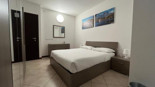 Кровать или кровати в номере Apartment "Borgo Carasso" con terazzo
