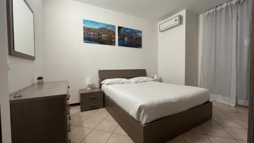 Кровать или кровати в номере Apartment "Borgo Carasso" con terazzo