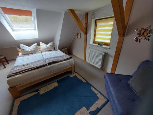 Кровать или кровати в номере Ferienwohnung Morgensonne Kurort Rathen