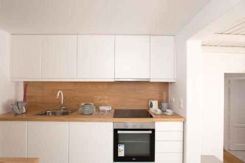 A kitchen or kitchenette at Mykonian apartment at Kalo Livadi beach with amazing view
