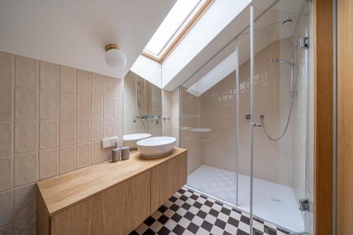 a bathroom with a shower and a sink and a toilet at Bright Designer Apartment In City Centre in Rīga