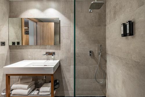 a bathroom with a sink and a shower at Astari in Tarragona