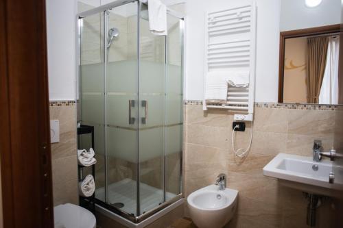 a bathroom with a shower and a toilet and a sink at B&B Palazzo Storico Di Nicola in Pescara