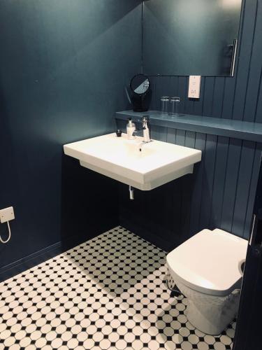 a bathroom with a sink and a toilet at The Boat Inn in Aboyne