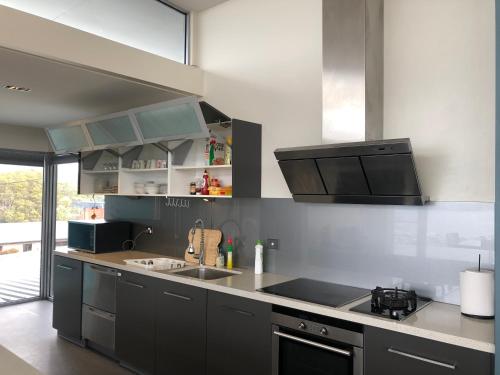 a kitchen with a sink and a counter top at Hobart View in Hobart