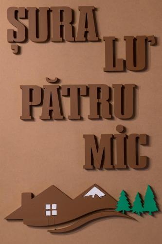 a sign on a wall with the words super lift patient mile at ȘURA LU' PĂTRU in Vulcan