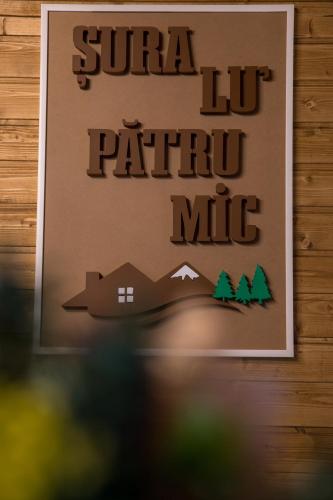 a sign on a wall that reads super lift patrol mic at ȘURA LU' PĂTRU in Vulcan