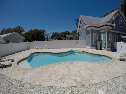 a swimming pool in front of a house at Barra Villa Resort House I in Fort Myers