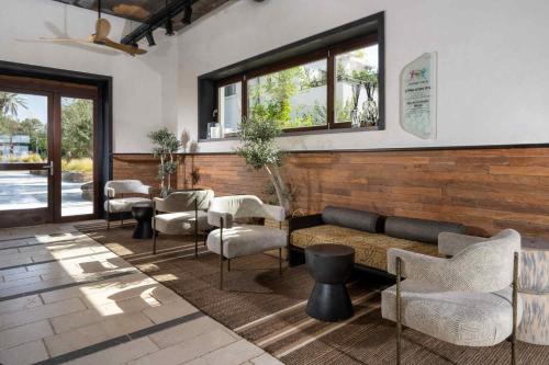 a lobby with a couch and chairs and tables at Pereh Mountain Resort in Gadot