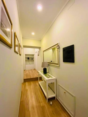 a room with a desk and a mirror on a wall at Garibaldi Home in Frosinone