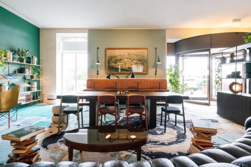 a living room with a table and chairs at B2 Hotel Zürich in Zürich