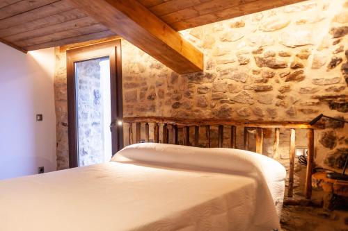 Katil atau katil-katil dalam bilik di Casa Sanui. Apartaments turístics rurals