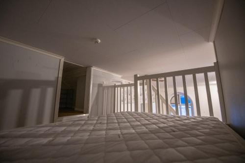 a bedroom with a bed in a room at Abisko Guesthouse & Activities in Abisko