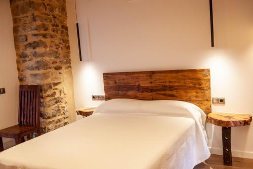 Katil atau katil-katil dalam bilik di Casa Sanui. Apartaments turístics rurals