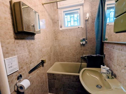 a bathroom with a sink and a bath tub at Deja FREE PARKING in Zvezdara