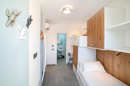 a small room with a bed and a desk at Casa sulle Mura in Loano