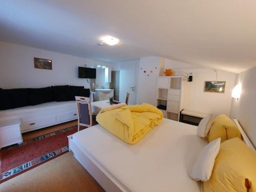 a living room with two beds and a couch at Bergkristall Apartments in Ischgl