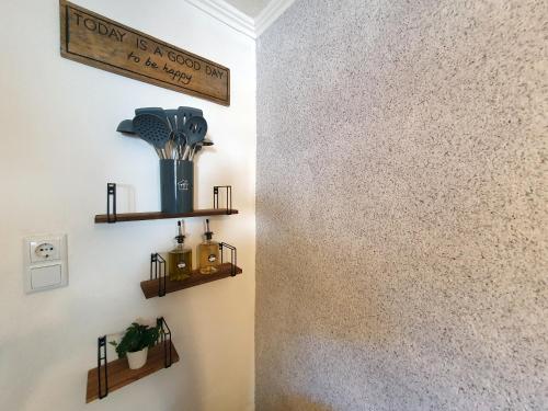 a room with two wooden shelves on the wall at Bergkristall Apartments in Ischgl