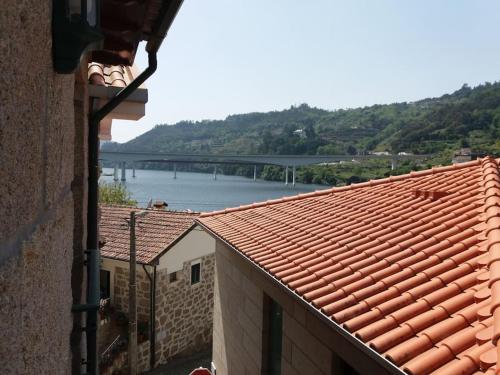 a view of a river and a bridge from a building at Meus Rios - moradia T1 entre o Douro e Tâmega in Torrão
