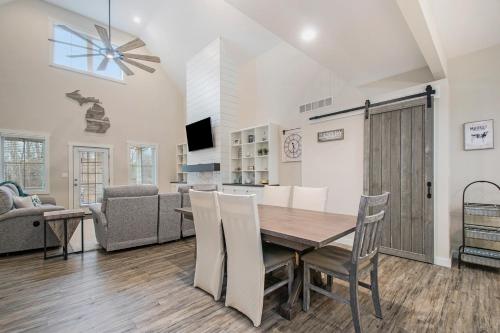 a dining room and living room with a table and chairs at Hidden Serenity in Sawyer