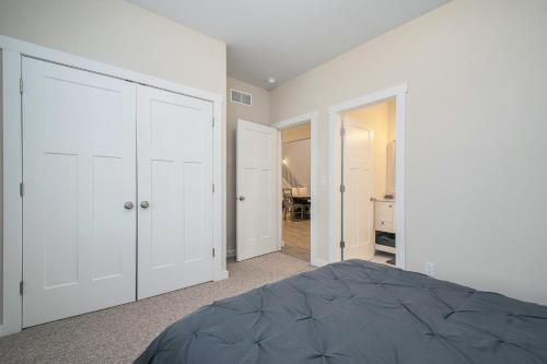 an empty bedroom with white walls and a bed at Hidden Serenity in Sawyer