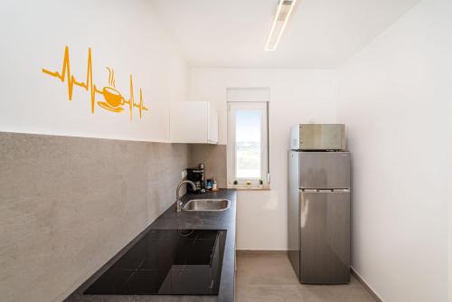 Kuchyň nebo kuchyňský kout v ubytování Appartments Kosamiri nahe Zadar