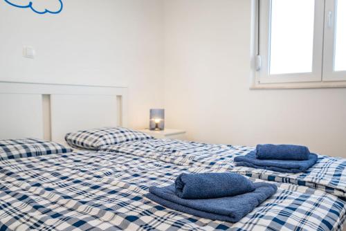 Postel nebo postele na pokoji v ubytování Appartments Kosamiri nahe Zadar
