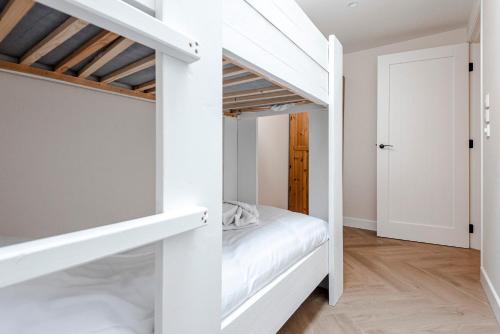 Postel nebo postele na pokoji v ubytování Dunefront Apartment