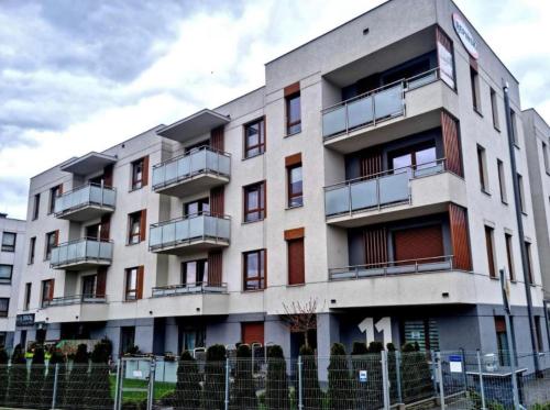 a building with balconies on the side of it at Apartament „My Angel z Sauną” w Kościerzynie in Kościerzyna