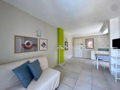 a living room with a white couch and a table at Aura Apartment Benidorm in Benidorm