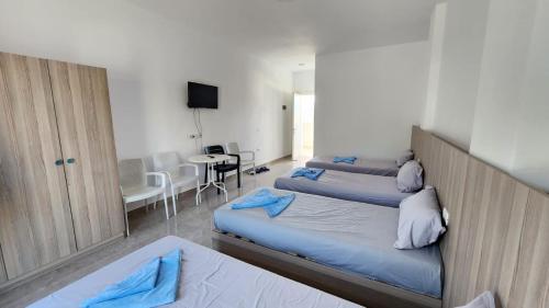 Postel nebo postele na pokoji v ubytování Sweet Hotel