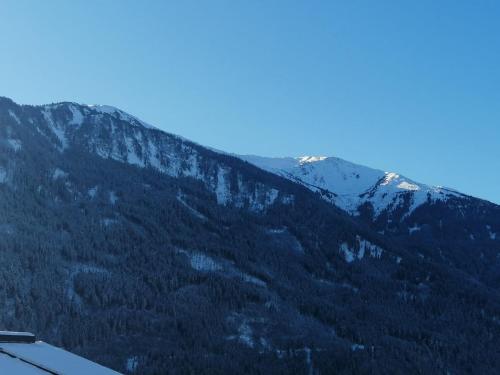 a view of a mountain with trees and snow at Apartment Apart Handle by Interhome in Fliess