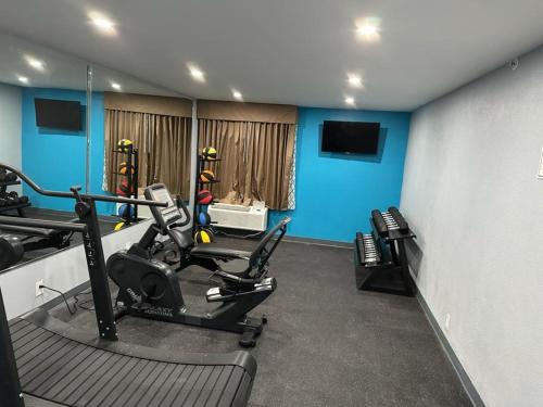 a room with a gym with two tread machines at Baymont by Wyndham Chattanooga Eastridge in East Ridge