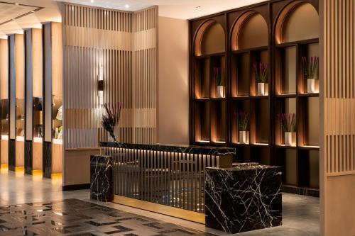 a lobby of a hotel with a reception desk at Four Seasons Hotel Minneapolis in Minneapolis
