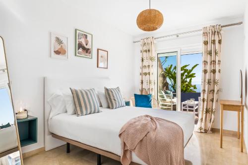 Ένα ή περισσότερα κρεβάτια σε δωμάτιο στο La Nea Beach Apartment