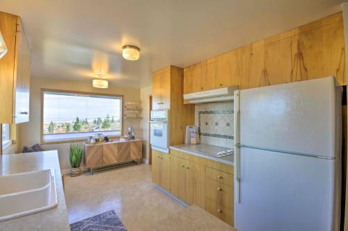a kitchen with a white refrigerator and a window at Port Angeles Pad Less Than 1 Mi to Olympic Natl Park in Port Angeles