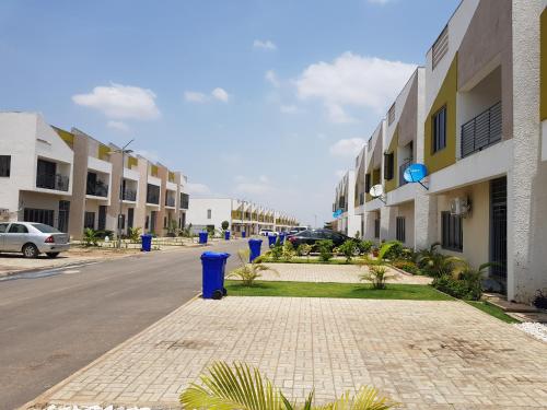an empty street in front of a building at Entire Serviced Two bedroom duplex Abuja - 24hr WIFI, POWER, OFFICE, FULL KITCHEN in Abuja