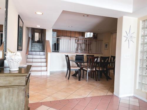 a kitchen and dining room with a table and chairs at OCEAN FRONT - STUNNING VIEWS- VACATION PARADISE!! in Dana Point