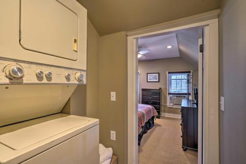 a bathroom with a sink and a bed in a room at 3-Acre Lodge with Snowmobile and Four-Wheeling Trails in Coudersport