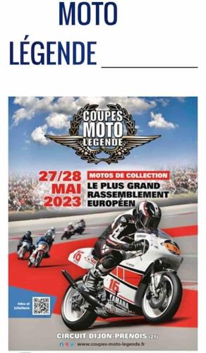 a poster of a motor cycle race on a magazine at Maison « De Ville en Vigne » in Chenôve