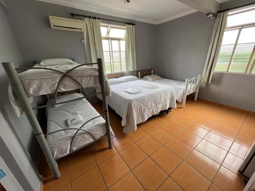 Katil atau katil-katil dalam bilik di Premium Center Hotel