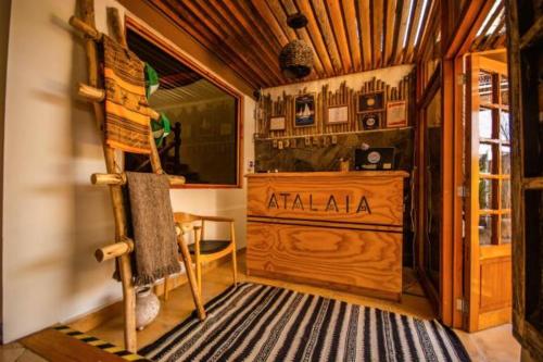 a room with a wooden cabin with a desk at Hostal Geosol in Antofagasta