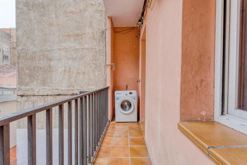 a washing machine in a hallway of a building at HOSTAL BEDMATES in Barcelona