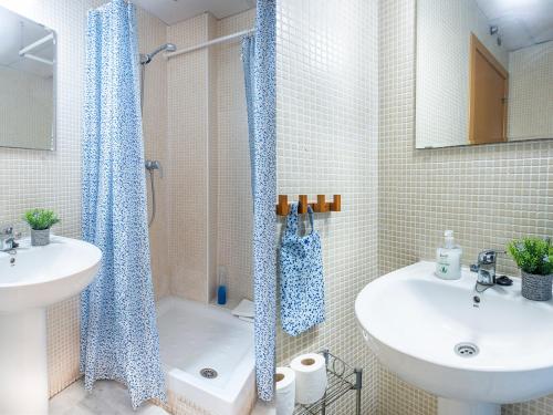 a bathroom with a shower and a sink and a toilet at Apartamento La Salle in Seville