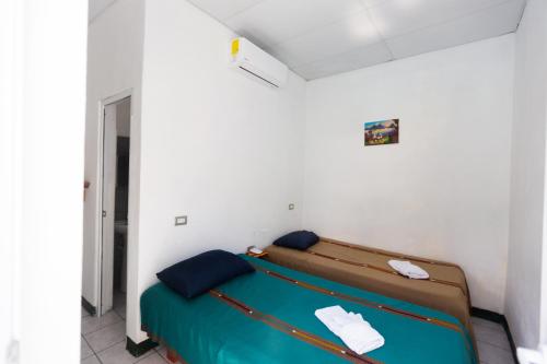 Säng eller sängar i ett rum på Hotel Villas Lucciana