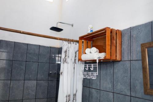 a bathroom with a shower with a shower curtain at Hotel Villas Lucciana in El Paredón Buena Vista
