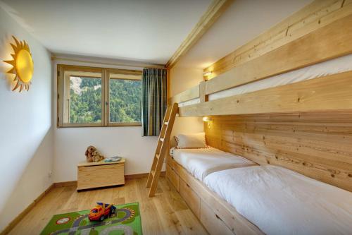 Postel nebo postele na pokoji v ubytování Chalet Le Charmieux - OVO Network