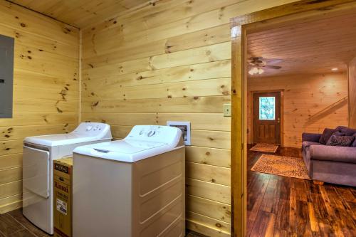 a log cabin with two washers and a dryer at Scenic Trade Cabin with Deck Near Boone and App State! in Trade