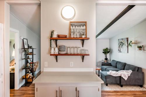 a living room with a couch and a table at Renovated Bungalow Getaway in Philomath